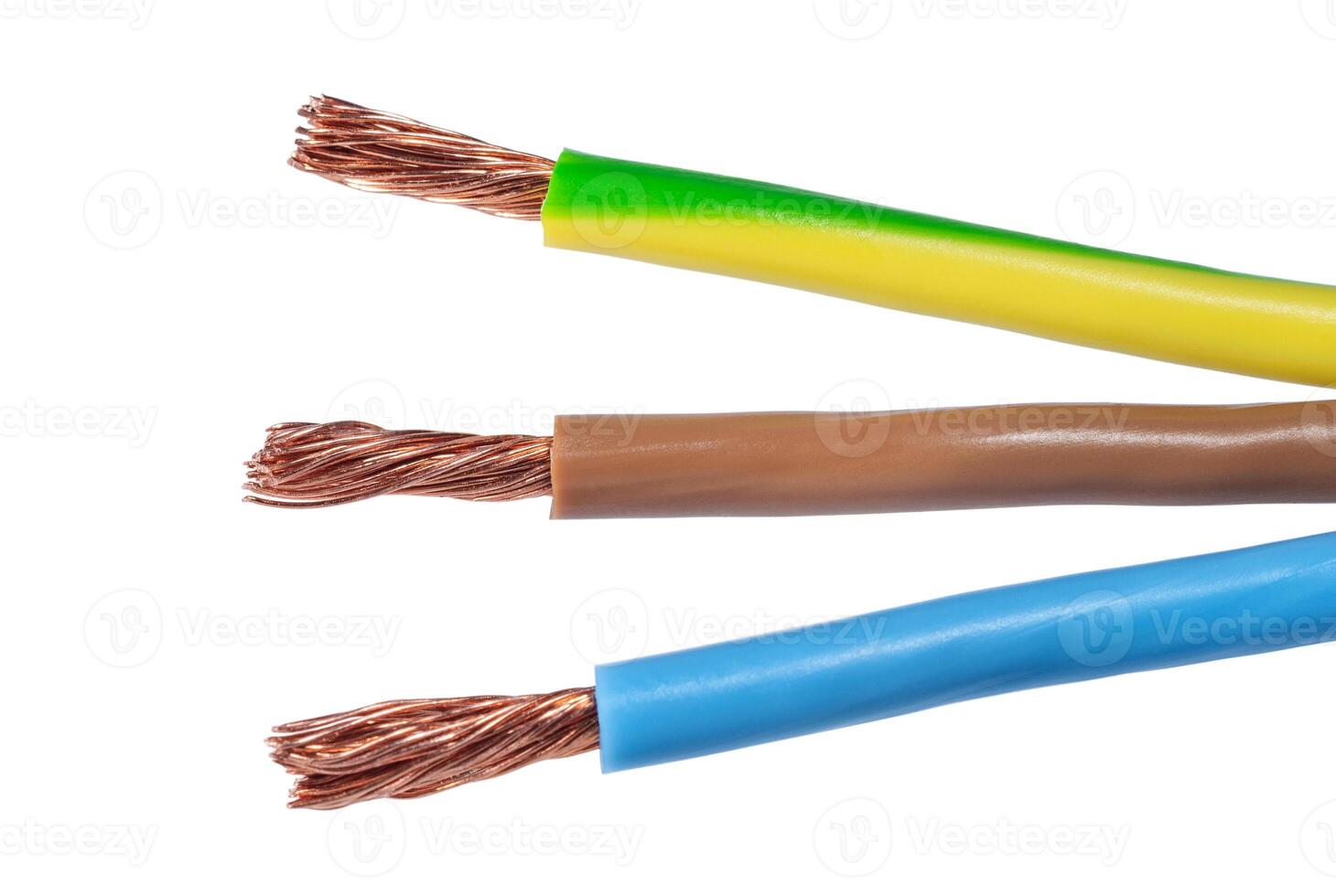 Three colored wires of electric cable on white. Electric technology and industrial concept photo