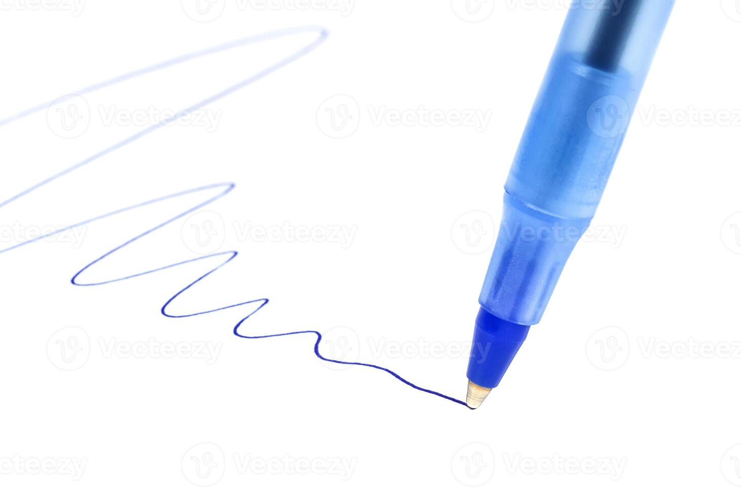 Writing blue ball pen on white paper photo
