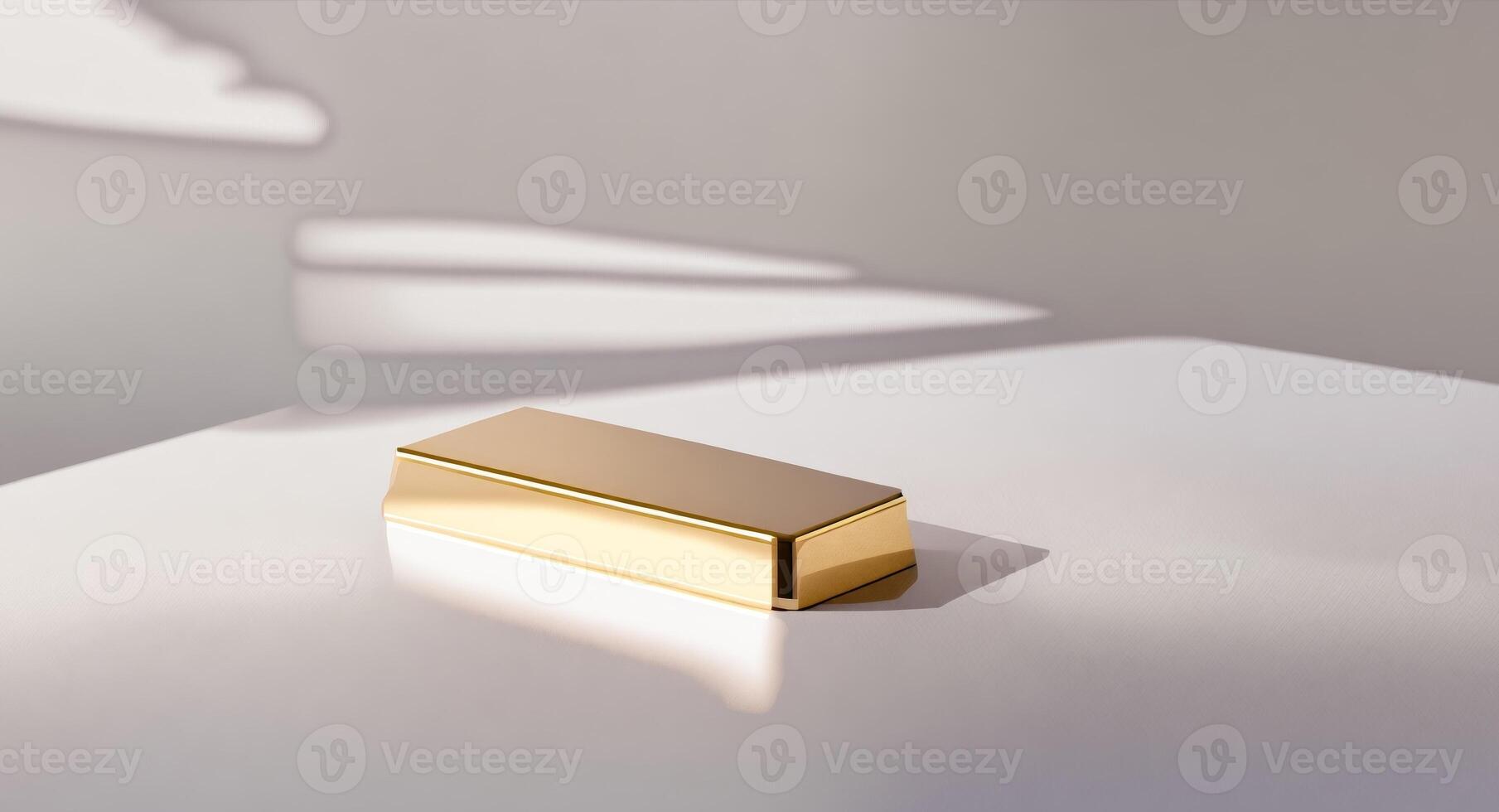 Gold Bar on a Clean White Surface with Soft Shadows photo