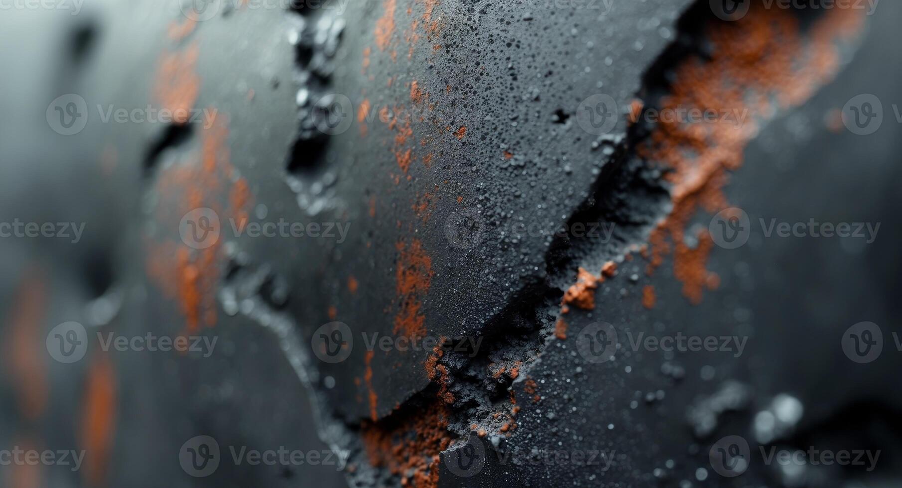 Close up of rough textured surface resembling concrete with black and oxidized areas photo