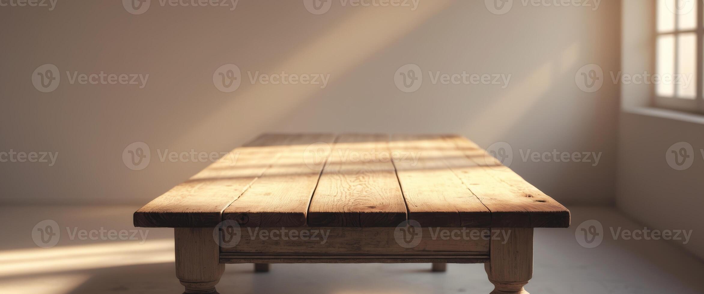 Wooden Table with Soft Shadows and Natural Light Streaming Through Windows photo