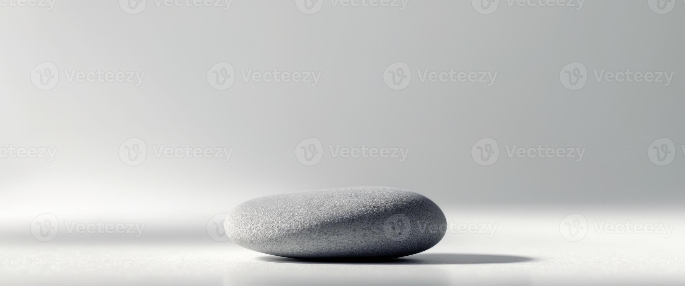 Single Pebble A pebble with a smooth outline and subtle texture photo