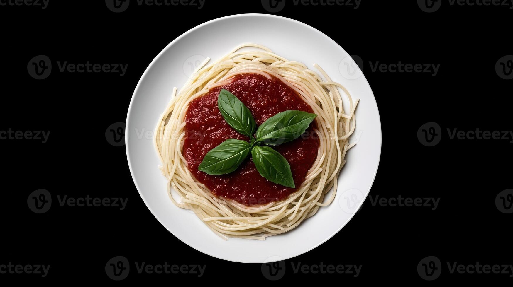 An overhead view of a plate of spaghetti with tomato sauce and basil. photo