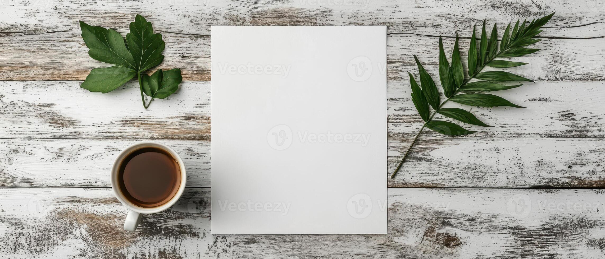 Blank paper with coffee and leaves on rustic wooden table photo