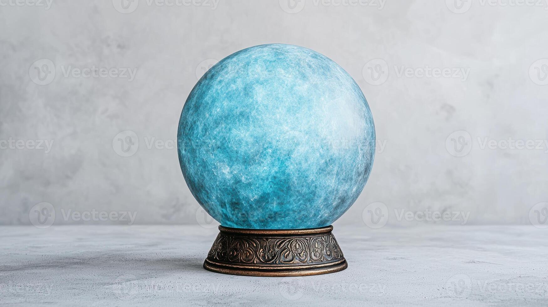 Blue crystal ball on a stand photo