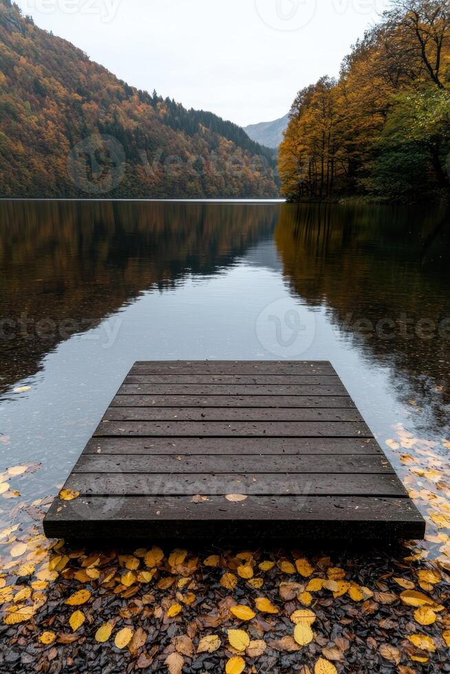 Serene autumn lake with wooden dock and colorful foliage photo