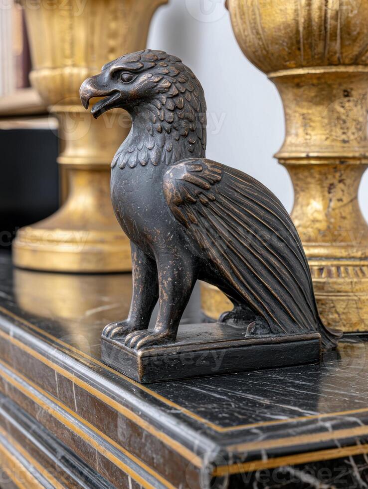 Bronze eagle statue on dark marble surface photo