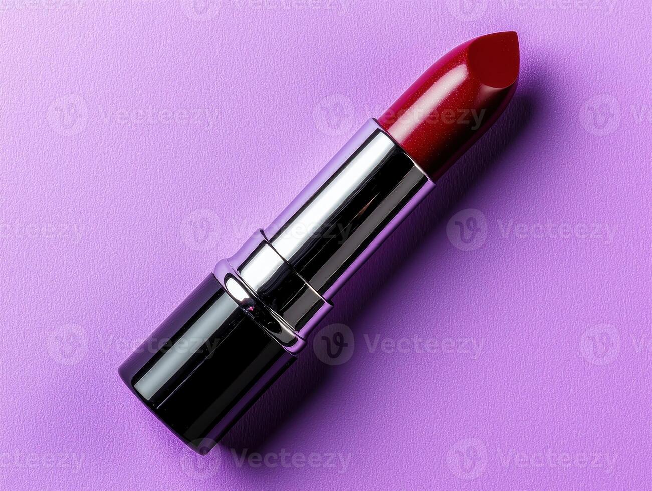 Red lipstick on a purple background. photo