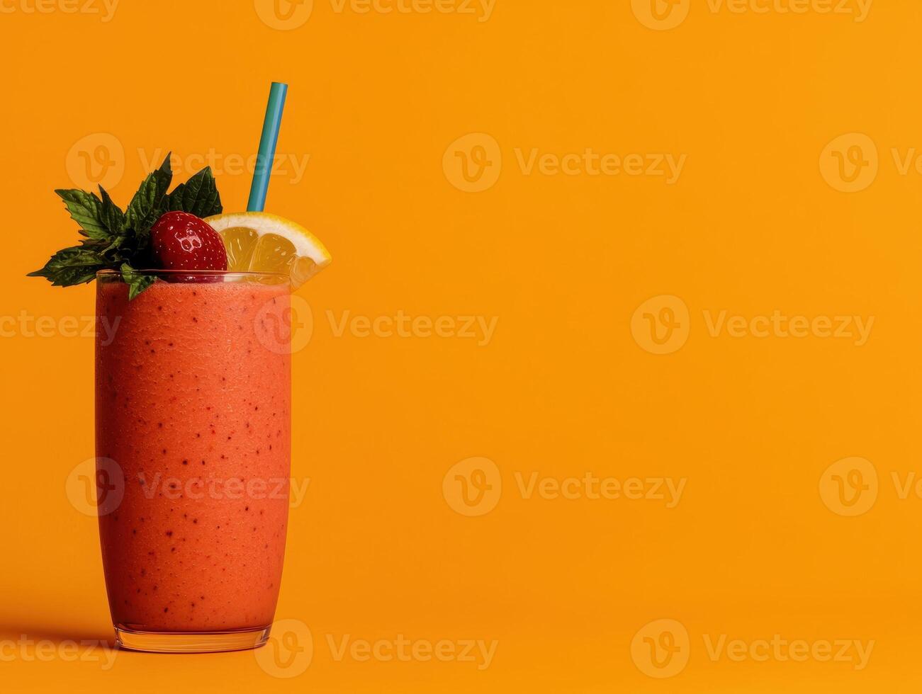 Refreshing strawberry smoothie in a tall glass with a straw photo