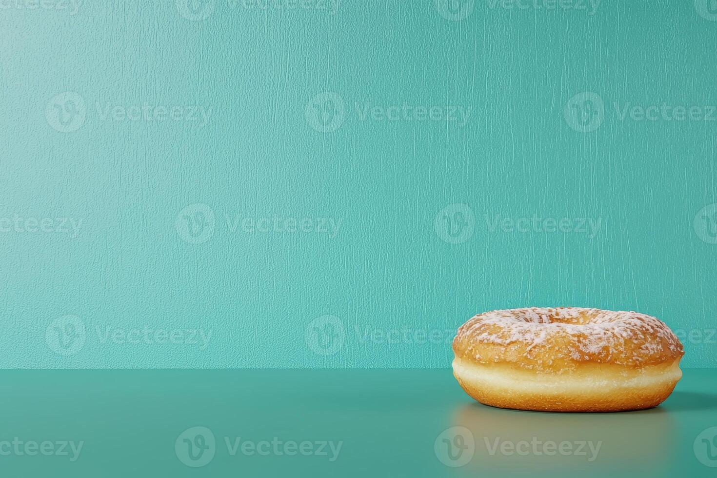 Glazed donut on teal background photo