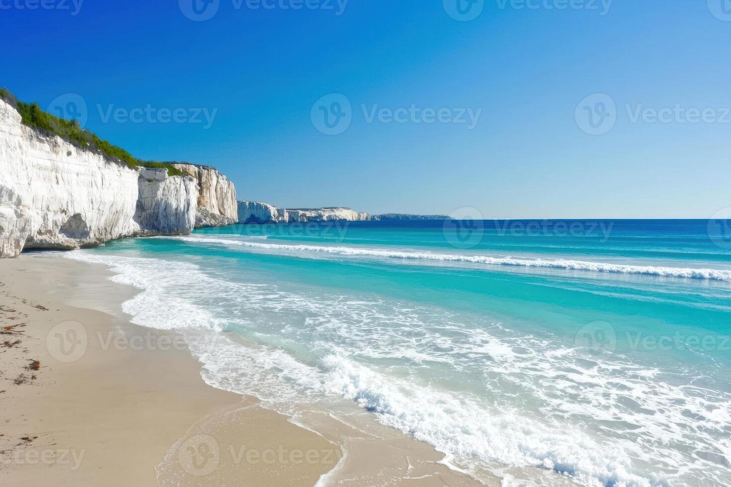 Waves crashing on a secluded beach with white cliffs photo