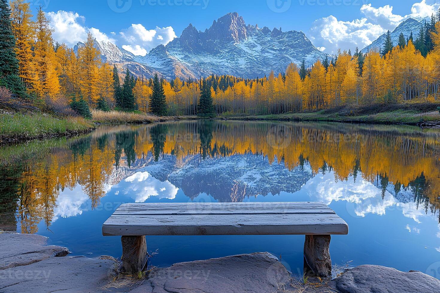 Tranquil Autumn Reflection in Mountain Lake with Vibrant Foliage and Scenic Landscape photo