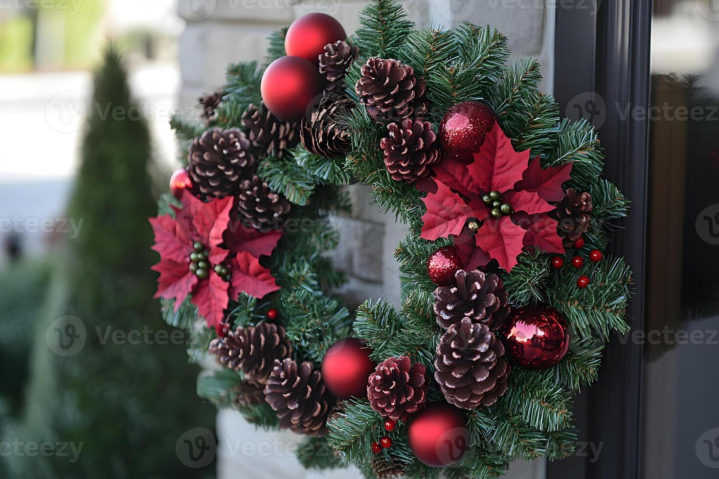 Festive Christmas Wreath with Pinecones, Red Ornaments, and Poinsettias Decoration photo