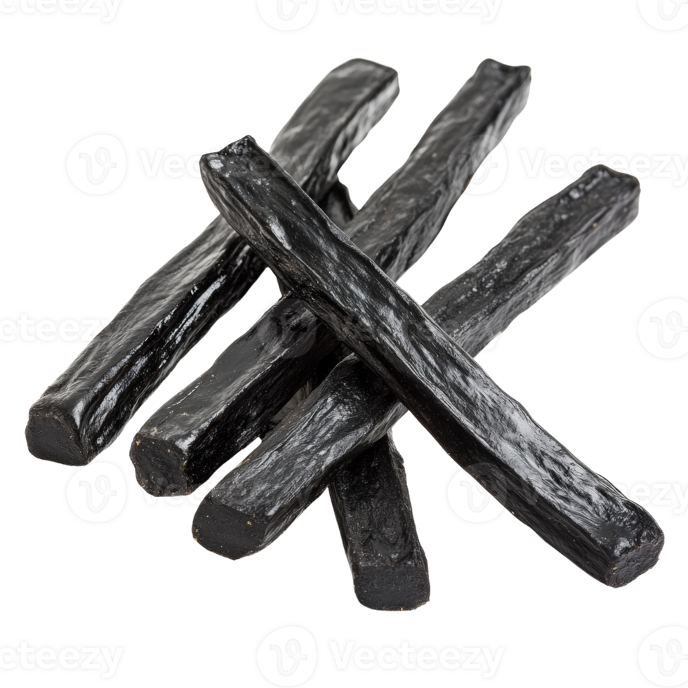 A Group Of Black Licorice Sticks Arranged On A Black Background png