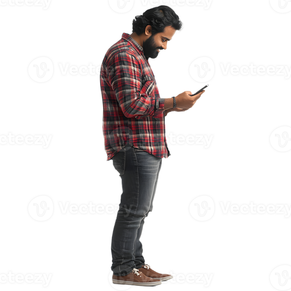 A man with a beard standing, gazing at his phone with a clear background png