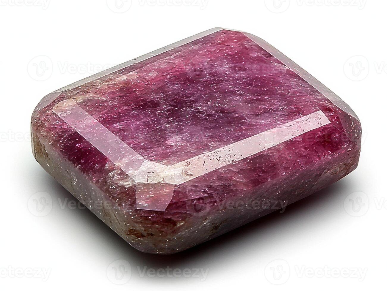 polished ruby gemstone vibrant deep red hue sits on pristine white surface. Soft lighting enhances its clarity and flawless facets revealing its brilliance photo
