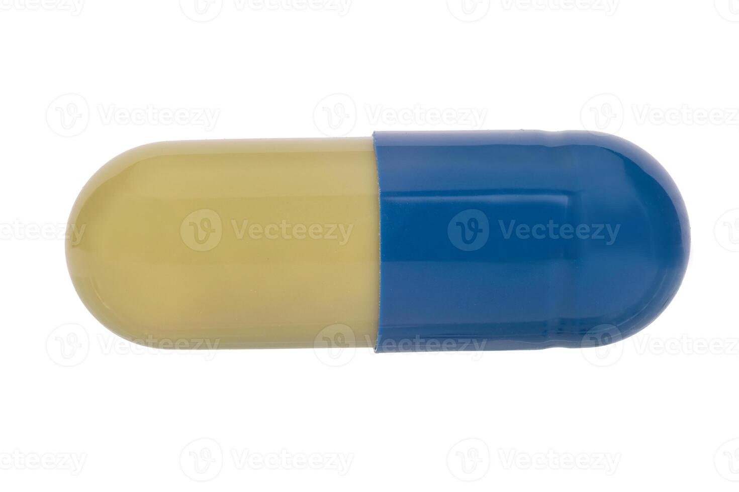 Closed medical capsule in blue and green photo