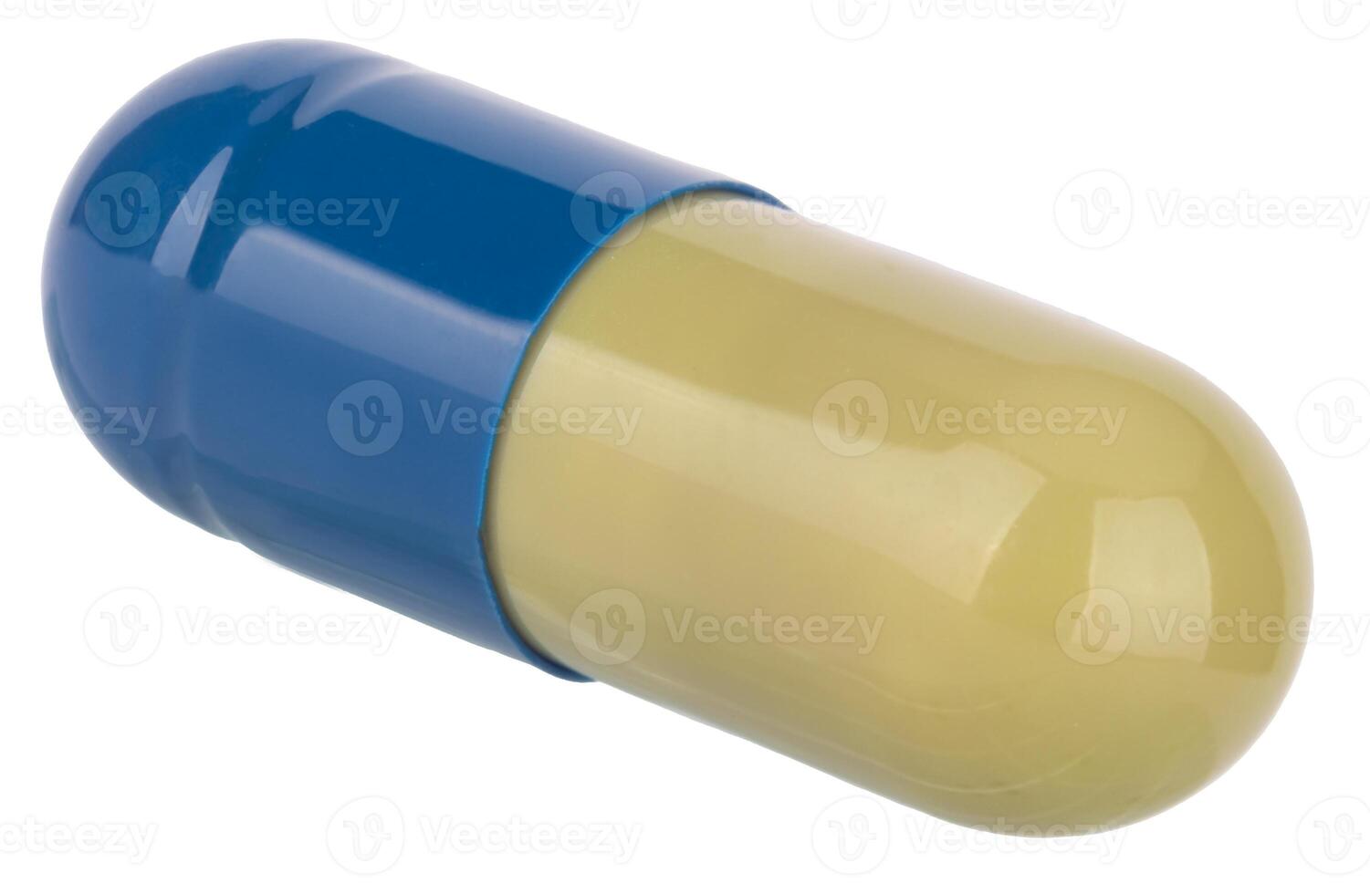 Single closed medical capsule in blue and green photo