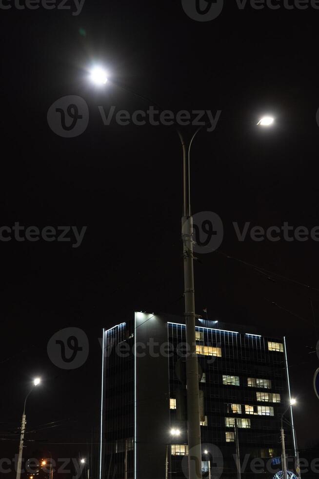 Illumination of a tall building in Minsk. University building at night photo