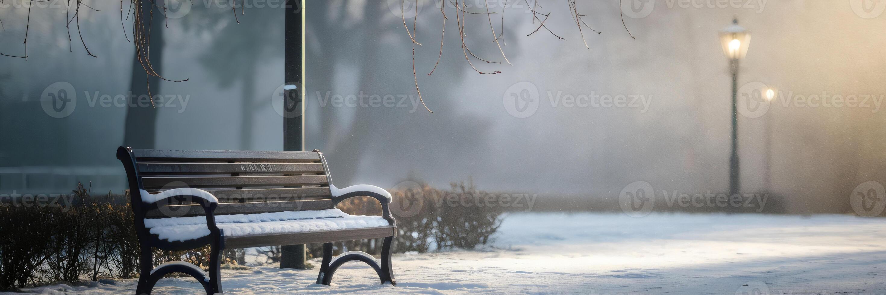 Snow-covered bench and lamp post in frozen winter landscape photo
