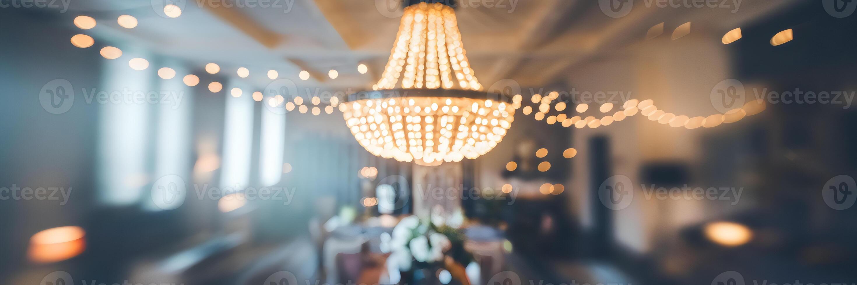 Blurred interior with glowing chandelier and soft bokeh photo