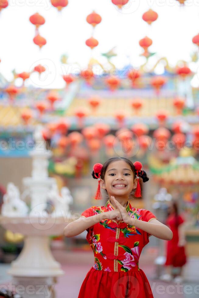 young Chinese girls with traditional dressing up celebrate Chinese new year photo