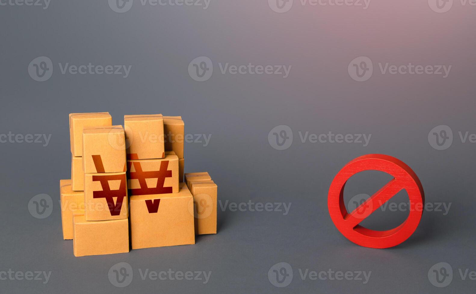 South korean won goods boxes and prohibition symbol NO. Trade wars. Oversupply. Confiscation of contraband. Shortage of goods. Sanctions and embargo. A ban on import of goods. photo