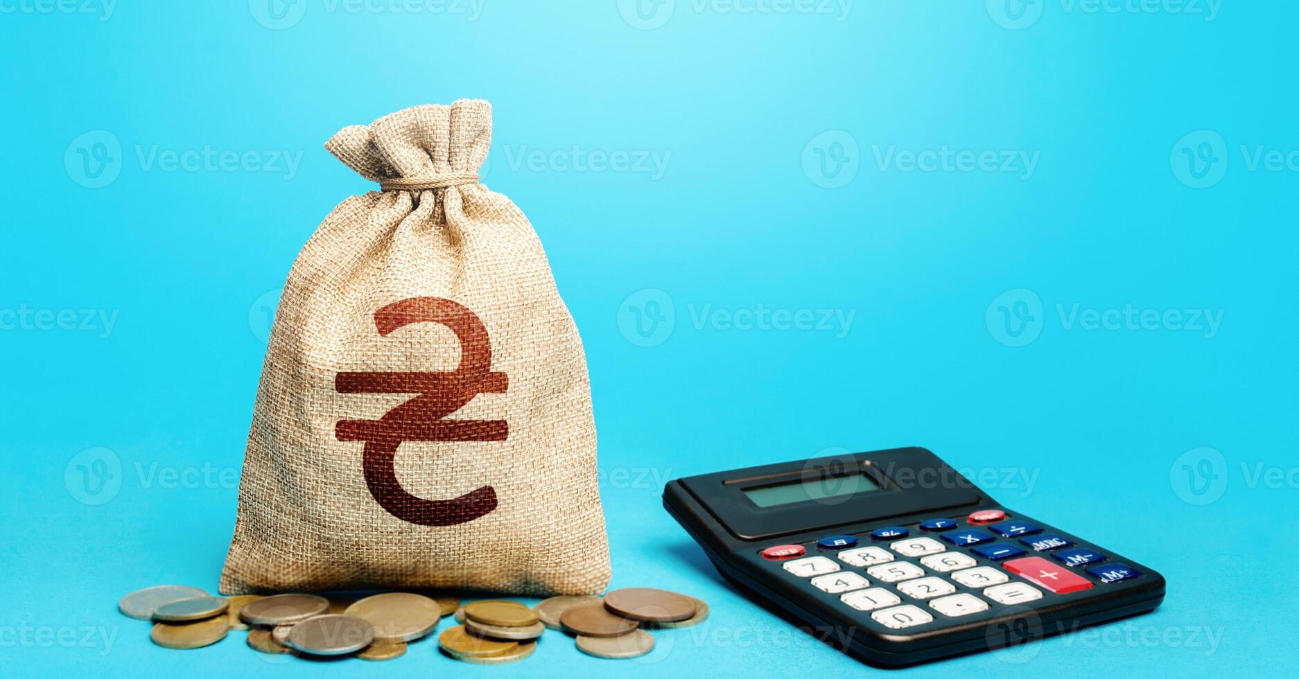 Ukrainian hryvnia money bag and calculator. Accounting concept. Summing up. Analytics of credit conditions. Profitable investments, financial market liberalization. Insurance payment calculation. photo