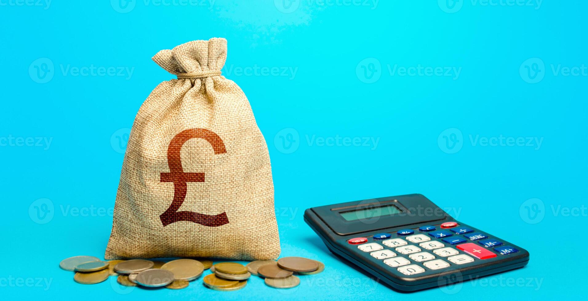 British pound sterling money bag and calculator. Accounting concept. Budgeting. Calculation of damage and insurance payments. Summing up the financial results. Analysis of loan selection. photo