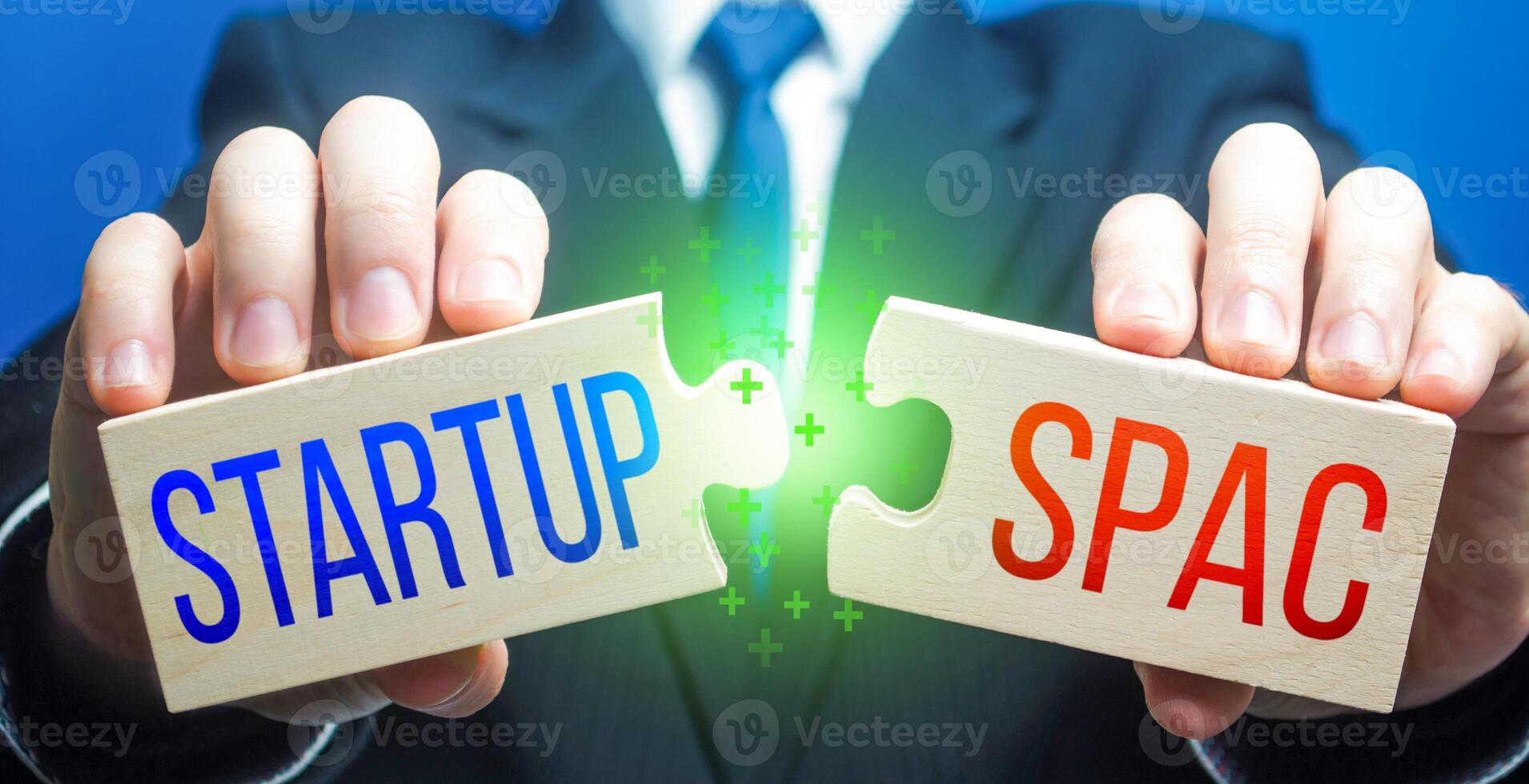 Man connects puzzles with Startup and SPAC. Simplified listing entry to stock exchange. Special purpose acquisition company. Attraction of investments, sale bonds shares for future company merger. photo