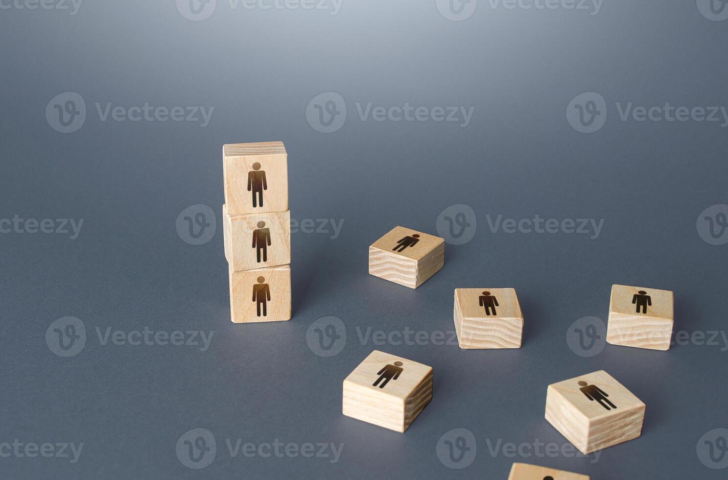 Figurine block tower with people. Hierarchical system. Company organization. Hiring, recruiting. Effective productive business employees group collectives. Team building personnel leadership. photo