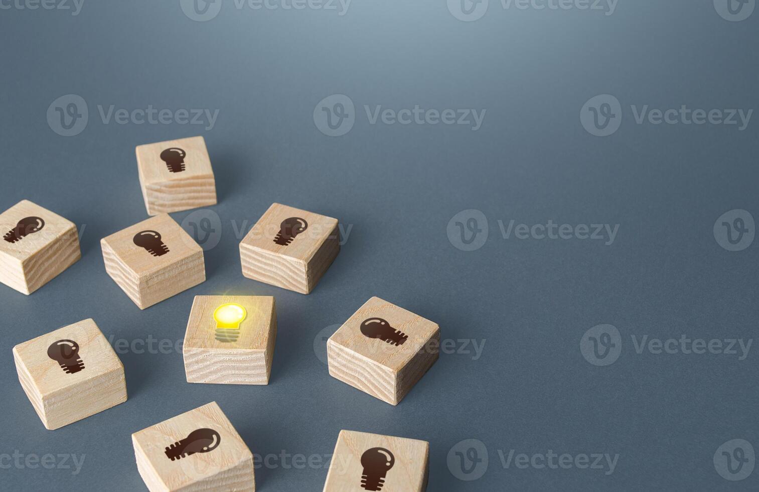 One glowing light bulb among many off. Choose the best idea. Investment in a promising successful startup technologies. Search for talents. First of all, fast response and feedback. Useful advice, FAQ photo