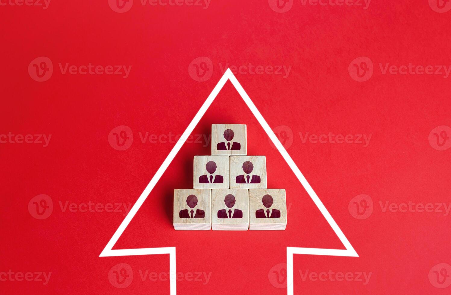 Business team group of people made of blocks in direction arrow. Strength in unity. Teamwork. Movement in a single group. Consolidation in a larger formation. Common interest, joint problem solving. photo