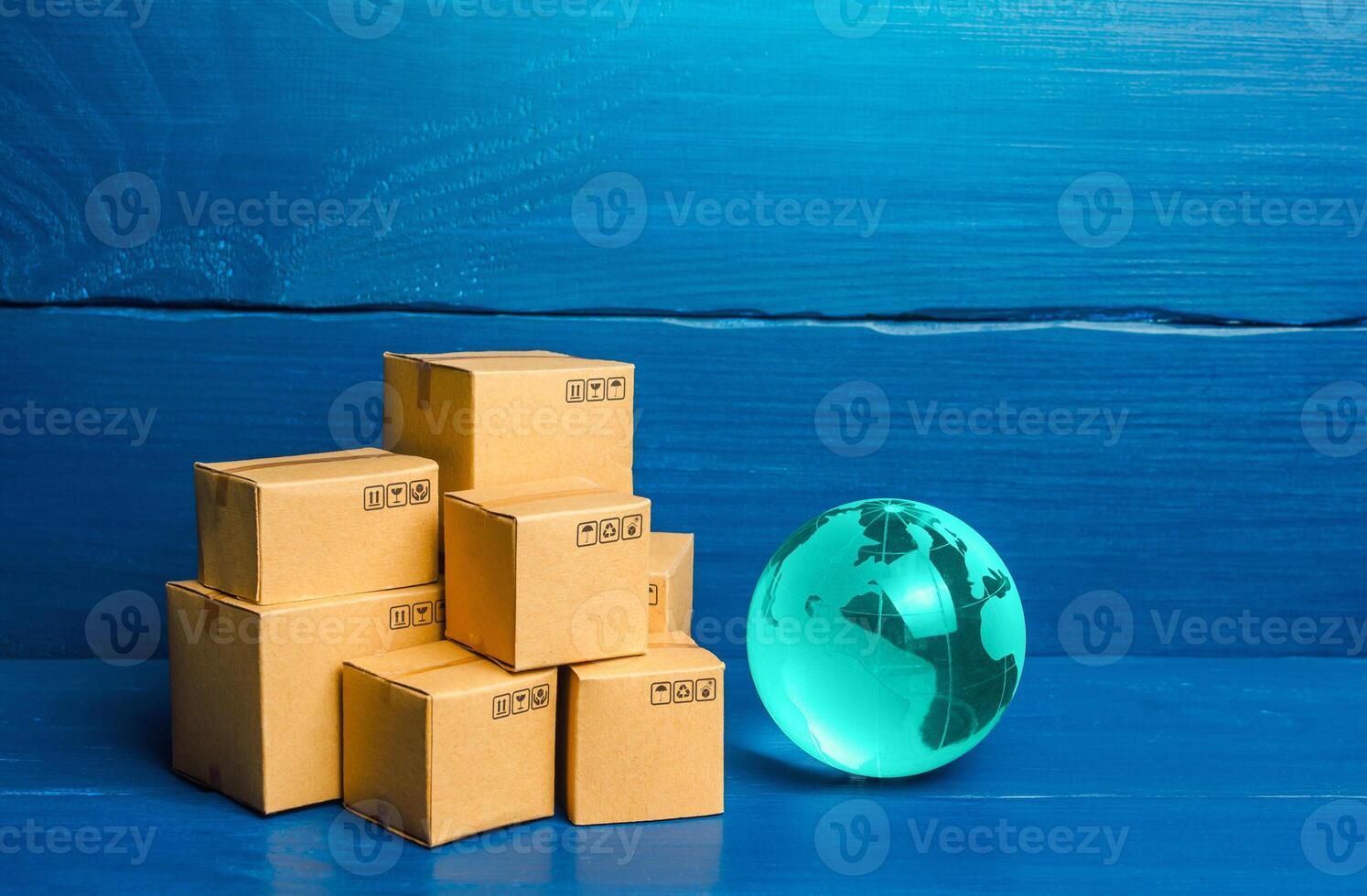 Planet Earth globe and boxes. Global business and world trade. Distribution of goods, import and export of products. Freight shipping delivery to new markets. International trade and transportation. photo