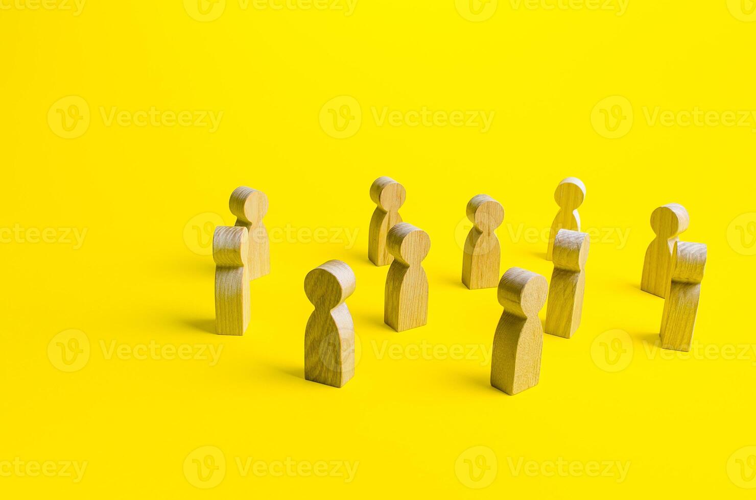 Figures of people stand randomly on a yellow background. People society concept. Behavior and social science relationships. Human resources. Personnel Management. Large group crowd photo