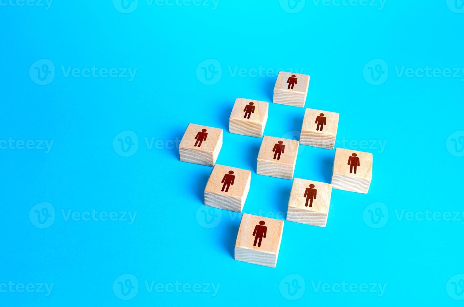 Figures blocks of people on a blue background. Concept of order, orderliness and uniform structure. Human resource management, hiring and staffing. Team building. Employee network. Business company photo