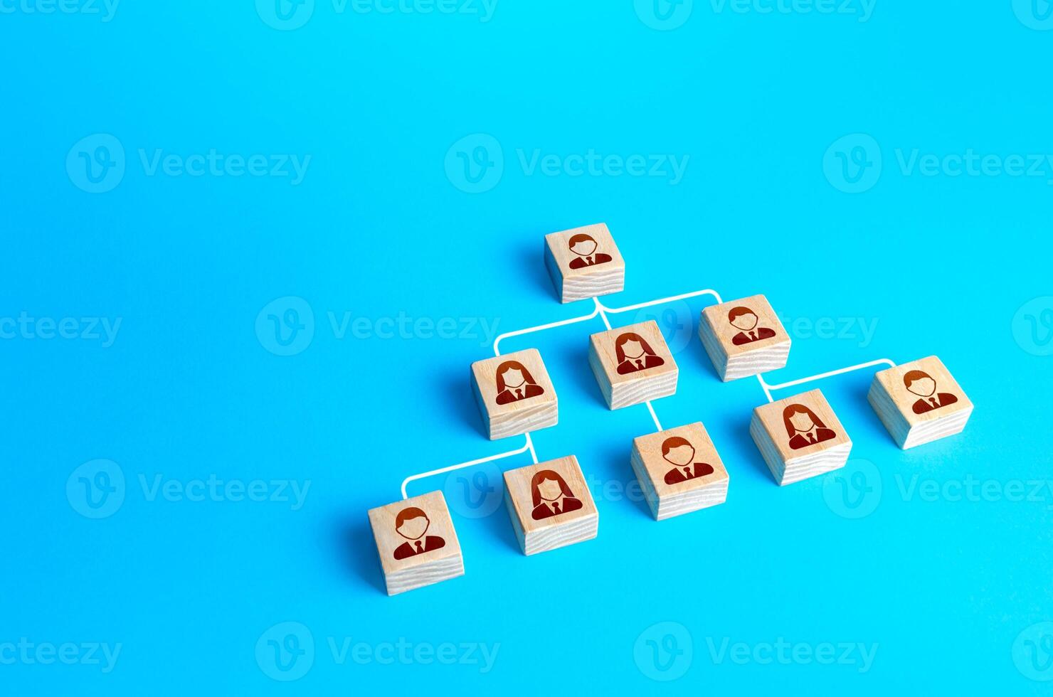 Blocks connected by lines form a hierarchical pyramid of the company. Personnel management and business management. Separation of duties and delegation of work and responsibility down the vertical photo