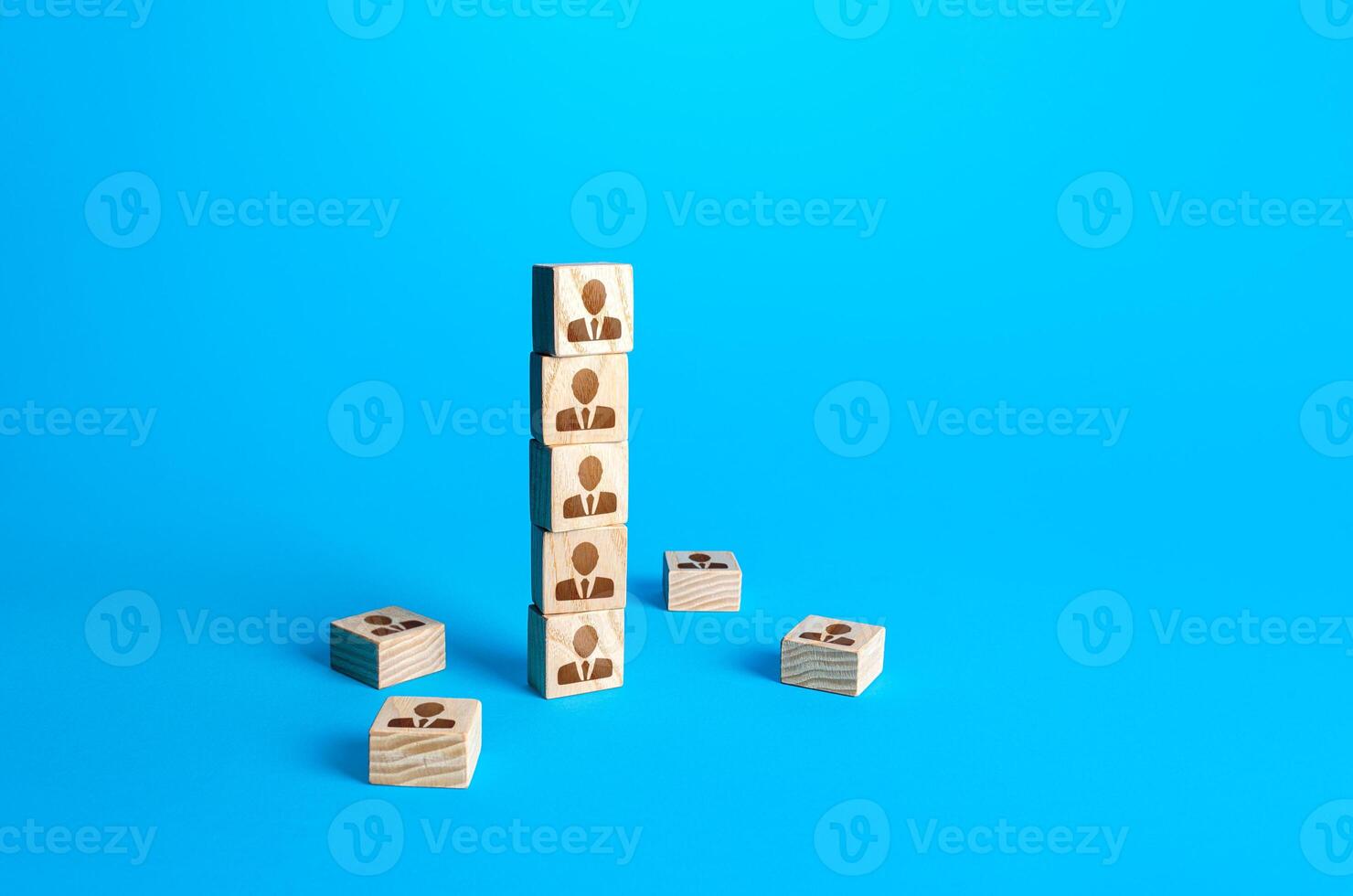 Block tower with people. Hierarchical system. Company organization. Hiring, recruiting. Team building personnel management. Organization of effective productive business employees group collectives photo