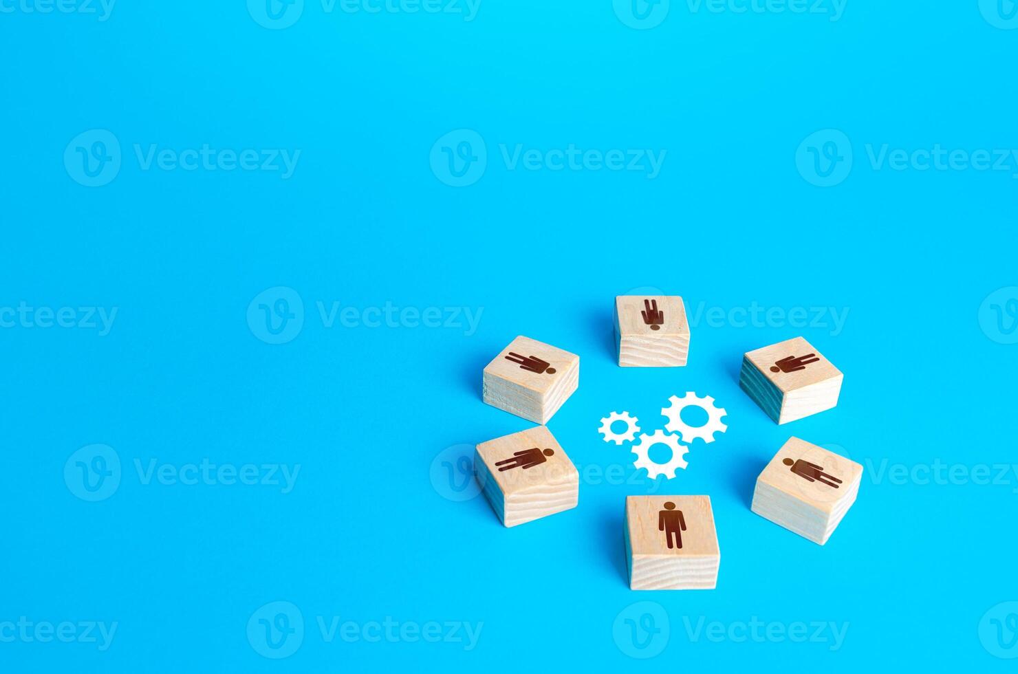 A circle of figures of people surround gears. Brainstorm. Joint efforts to solve problems. Teamwork. Negotiation and dialogue. Development of measures. Working on a common project. Cooperation photo