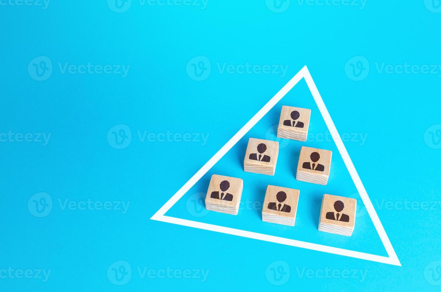 Blocks of people are joined together in a triangle. Combining efforts to achieve goal. Business team formation. Functioning of a self-organized community without a leader. Performance and flexibility photo