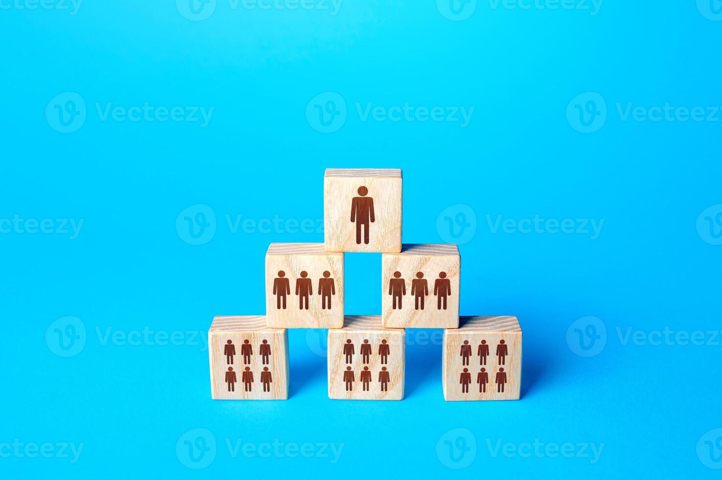 Blocks with people are built in a triangle. photo