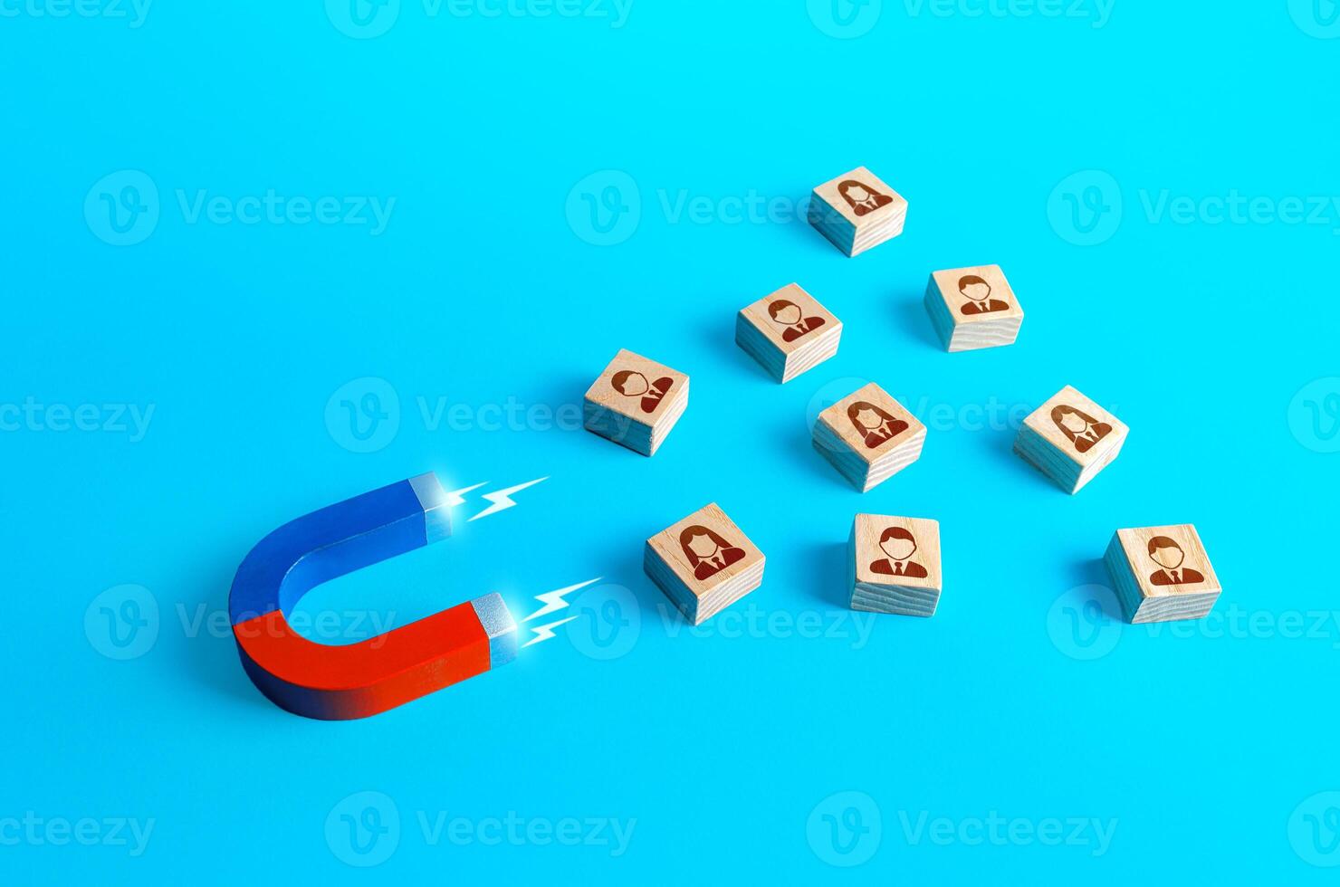 Magnet attracts people. Recruiting new workers. Poaching employees to more favorable conditions. Search for specialists and professionals. Business team building. Hiring. Collection of personal data photo
