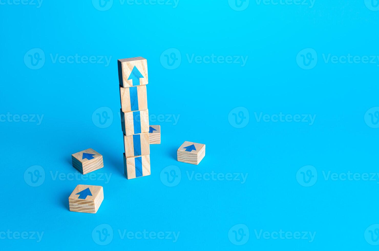 Block tower with arrows. Business growth and development concept. Achieve success. Building career advancement, improving skills. Goal achievement. Progress and movement forward. Self improvement photo