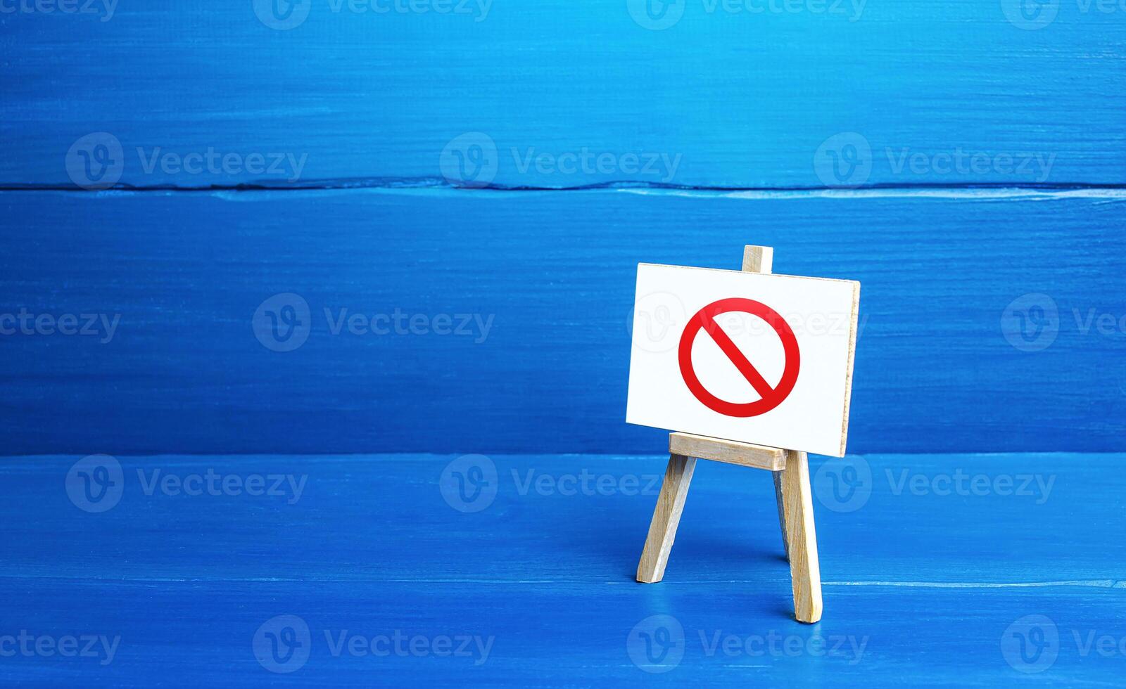 Easel with the prohibition sign NO. Restricted area. Absence. Restrictions and sanctions. Inaccessibility. Ban and Embargo. Failed strategy. Denying entry, stopping action processes. Limitations. photo