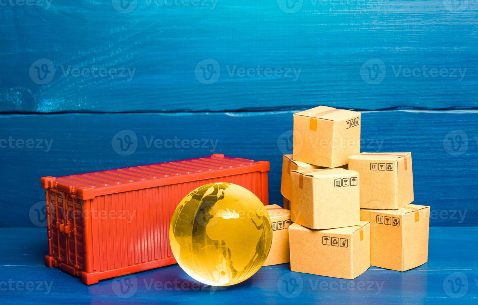 Planet Earth globe near a cargo container and boxes. World trade in goods. Economic ties. Production chains and product distribution. Freight shipping delivery. Transportation and transfer photo