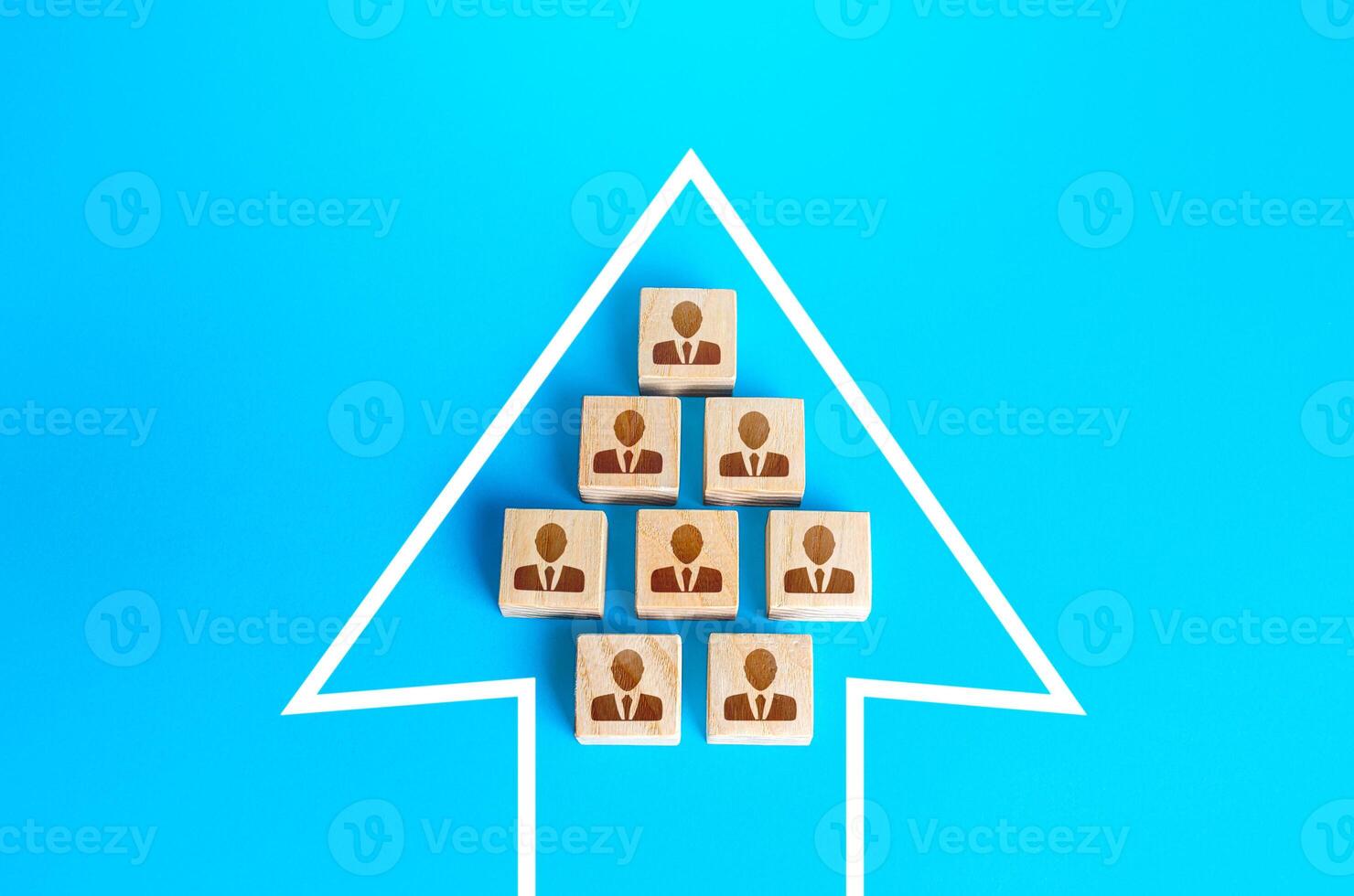 A group of people in the arrow. Movement in a single formation. Joint achievement of goals and tasks. Unity. Society consolidation. Team discipline, teamwork cooperation. Coordination of actions. photo