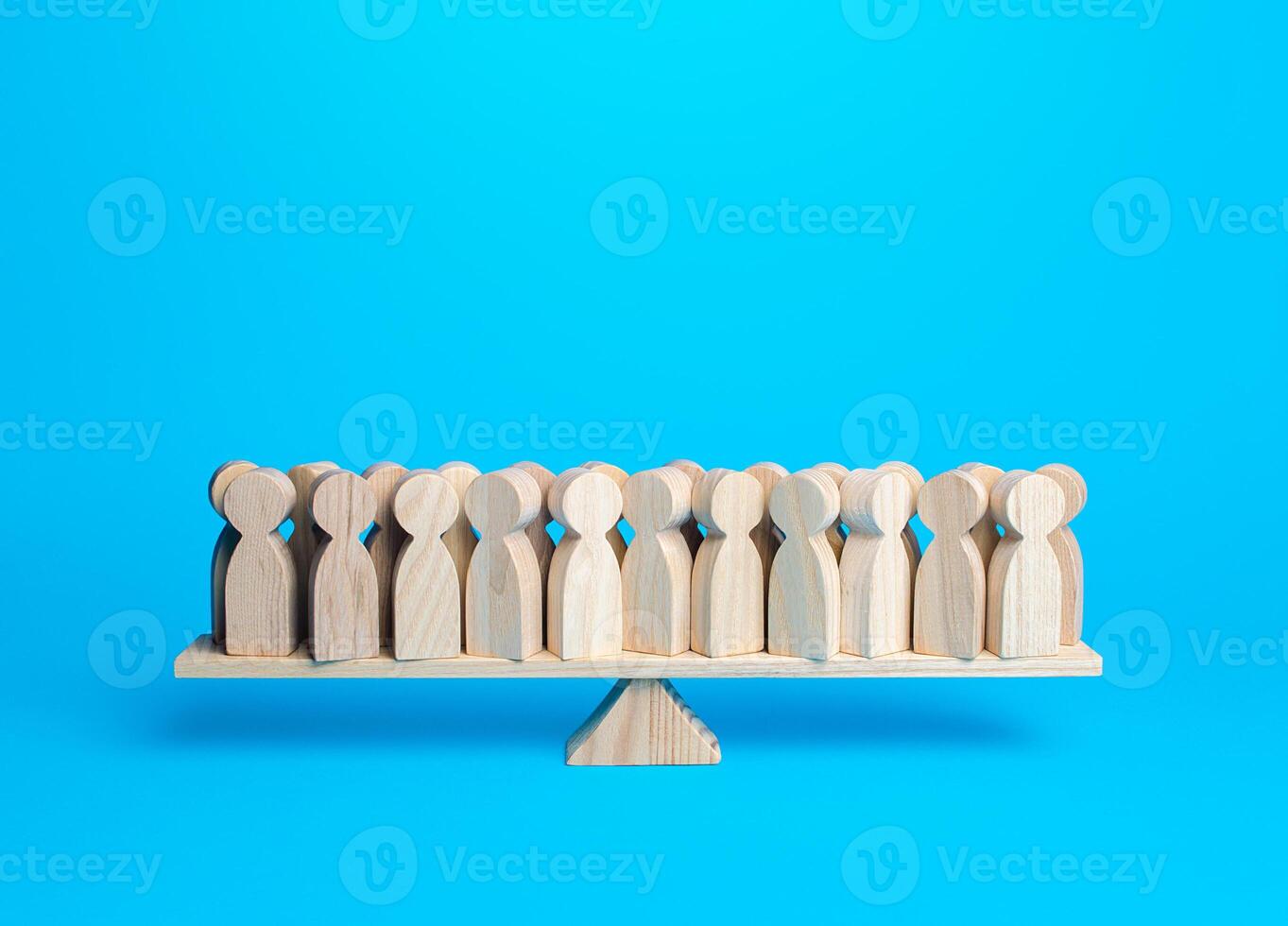 Lots of people on the scales in balance. Harmony and understanding. Unity and striving for stability. Lack of leaders and influence, the inert mass of society. Studies of political preferences. photo