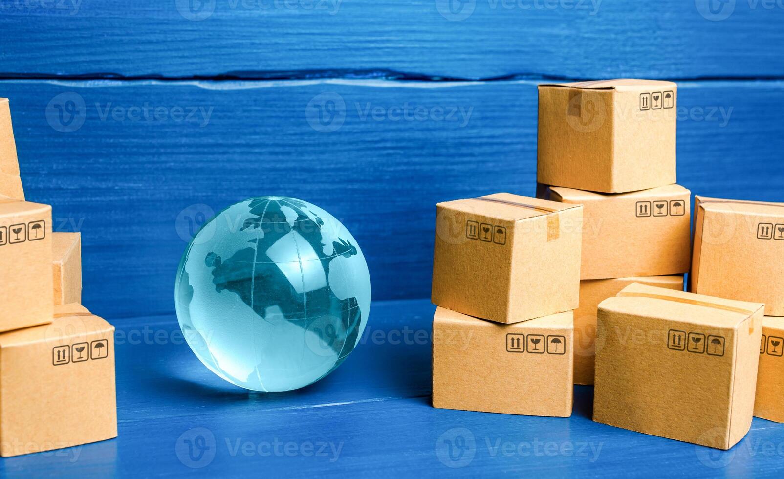 Planet Earth globe and cardboard boxes photo