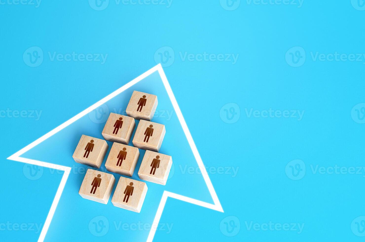 A group of people form a single movement arrow. Consolidation, striving for a common goal. Organization and cooperation. Strength in unity, teamwork. Joint achievement of goals and tasks. Unity. photo
