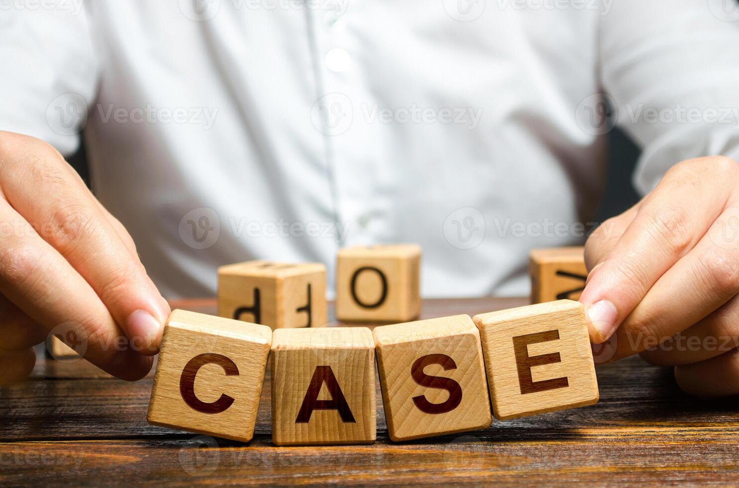 Man raises falling apart blocks with word Case. Concept of collapse of a trial, insufficient evidence, innocence. Closing court case. Defense lawyer attorney services. Failed indictment act photo
